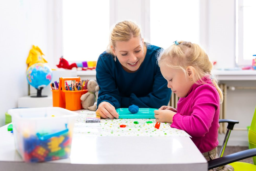 Toddler In Child Occupational Therapy Doing Sensory Playful Exercises