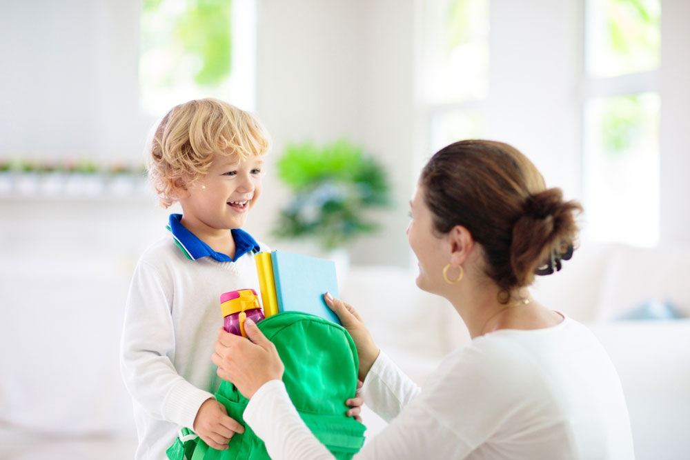 Little Boy Receiving His School Bag