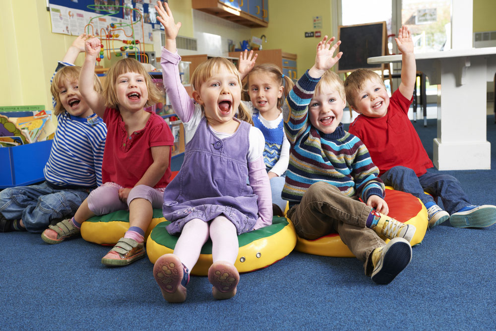 Children Answering Question In Classroom